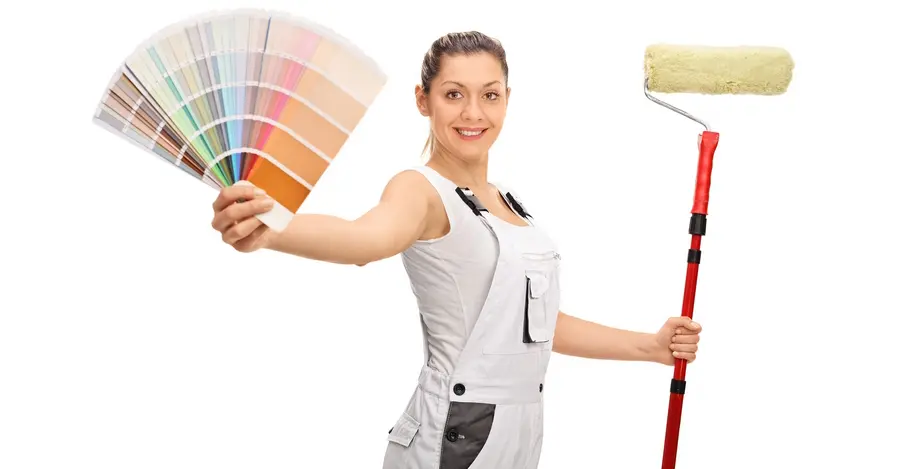 Woman holding paint color palette, options